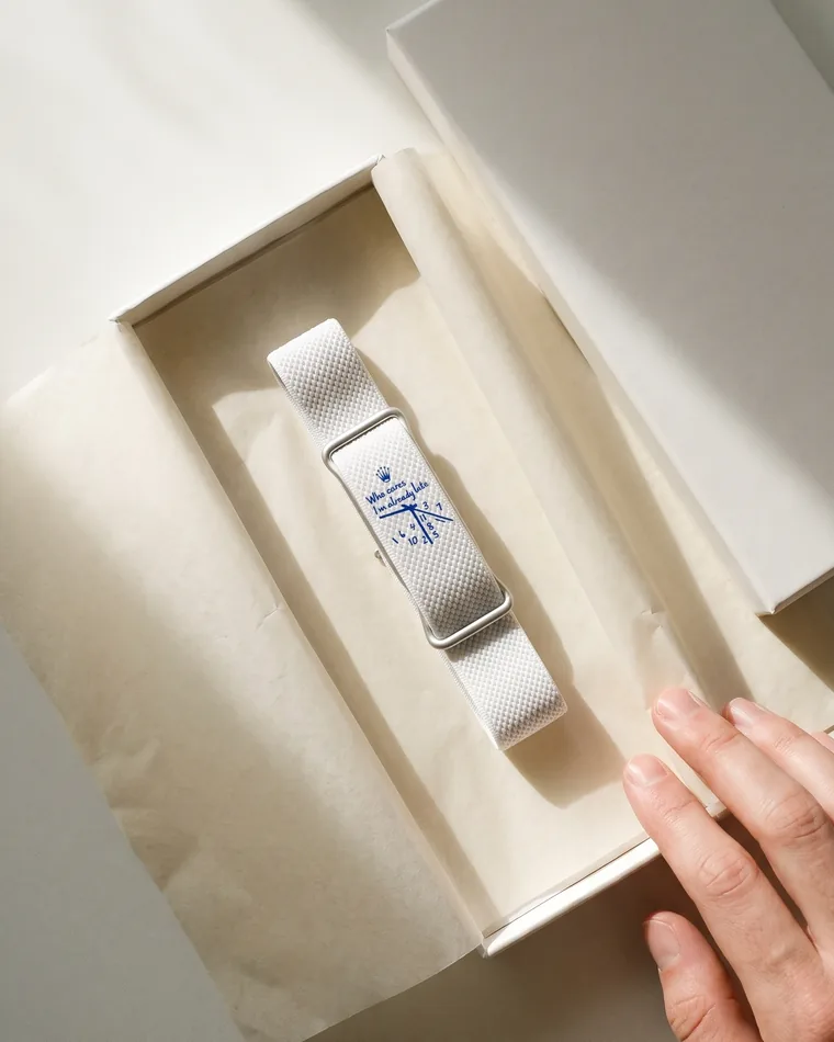 The Signature Band in its box, tissue folded back